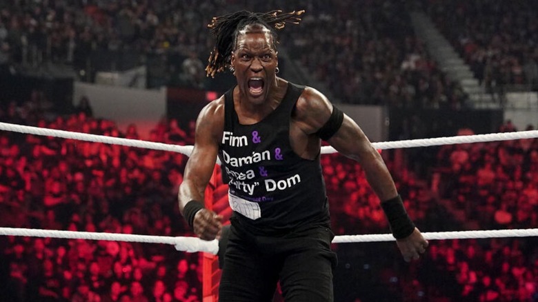 R-Truth prepares to deliver a move to an opponent in the corner of the ring during a match on 