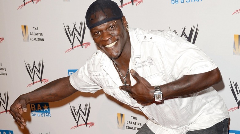 R-Truth with his arm around Little Jimmy