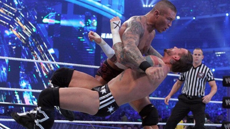Randy Orton hits CM Punk with a clothesline at WrestleMania 27