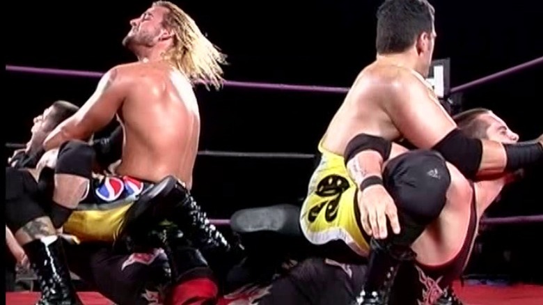 Second City Saints Briscoes camel clutch