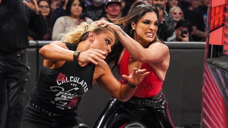 Raquel Rodriguez moves to throw Zoey Stark into the ring on an episode of "WWE Raw."