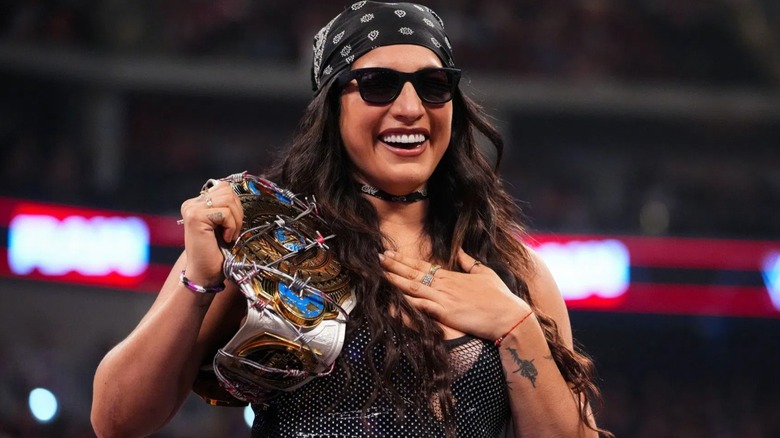 WWE Women's Intercontinental Champion Raquel Rodriguez smiles on with her newly won championship