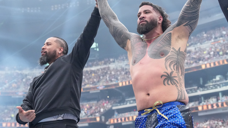 Jimmy Uso holds up Jey Uso's hand at WrestleMania 41.