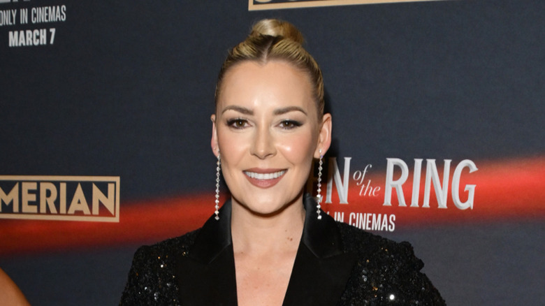 Renee Paquette smiling at a movie premiere