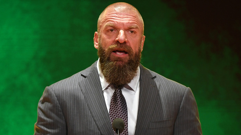 WWE CCO Triple H awaits a question from the press
