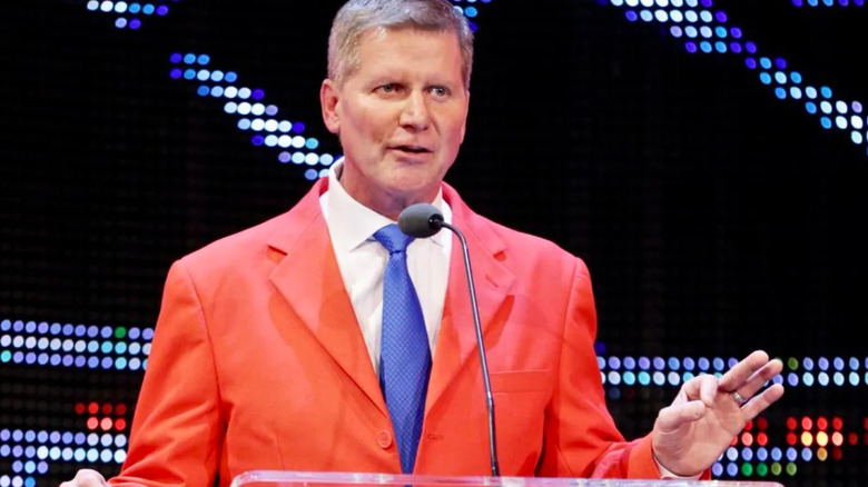 John Laurinaitis wearing a red suit
