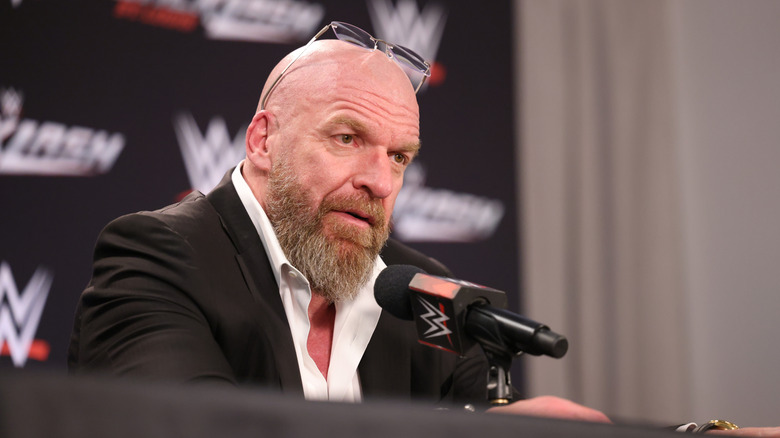 Triple H speaking at a press conference