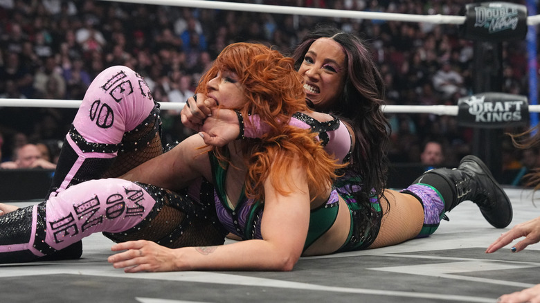 TBS Champion Mercedes Mone gets Jamie Hayter in a submission hold down on the mat during their match at AEW Double or Nothing.