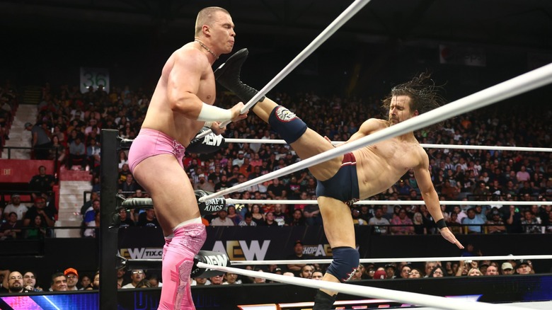 Kyle Fletcher eating a kick from Adam Cole during their clash on 