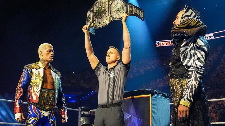 A referee holds up the Crown Jewel Championship between Cody Rhodes and Seth Rollins ahead of their match for the title at WWE Crown Jewel 2025.