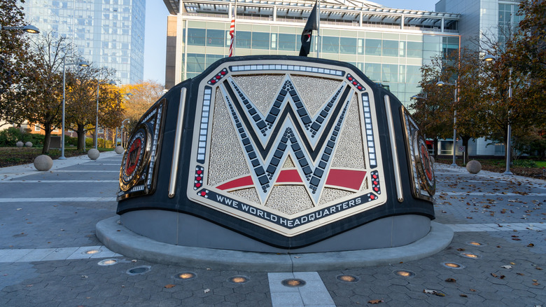 A sculpture of a championship belt in front of the offices of WWE on Washington Boulevard in Stamford, Connecticut, on November 7, 2023. WWE is an American professional wrestling promotion.