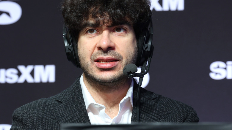 Tony Khan wearing a headset