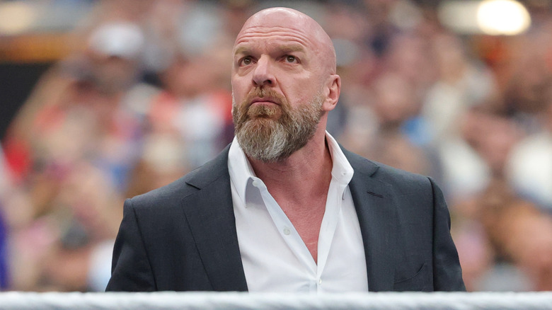 Paul Levesque in the middle of the ring addressing fans during WrestleMania 41.