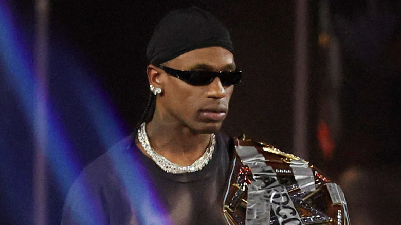 Travis Scott with his Hardcore Title belt