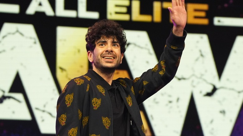 AEW President Tony Khan waves to the crowd during an AEW event
