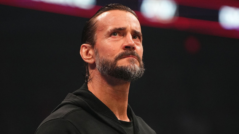 CM Punk looking serious in black hoodie