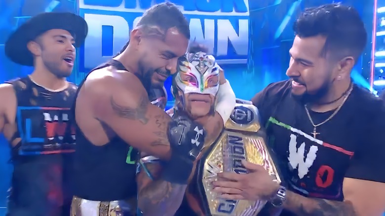 Rey Mysterio embraced by the LWO