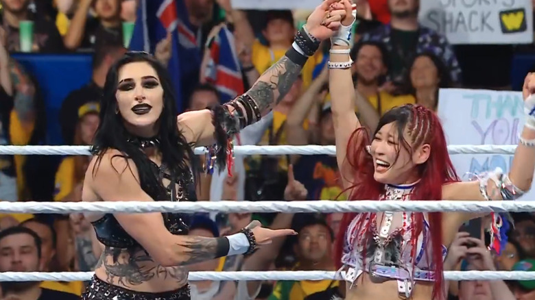 Rhea Ripley and Iyo Sky celebrate after winning at WWE Crown Jewel 2025