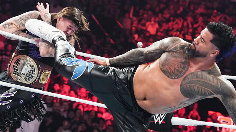 Jey Uso superkicking "Dirty" Dominik Mysterio