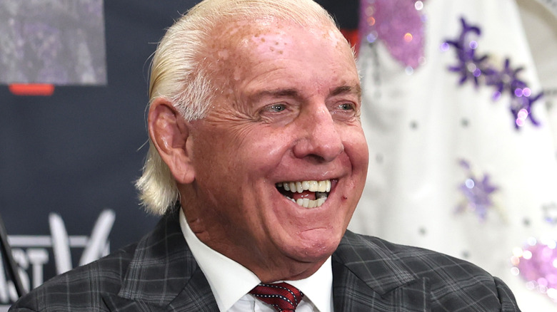 Ric Flair smiling at a press conference