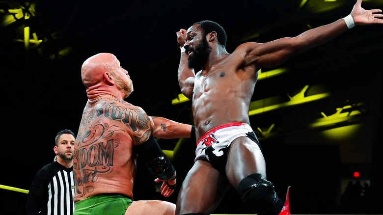 Rich Swann prepares to strike Eric Young