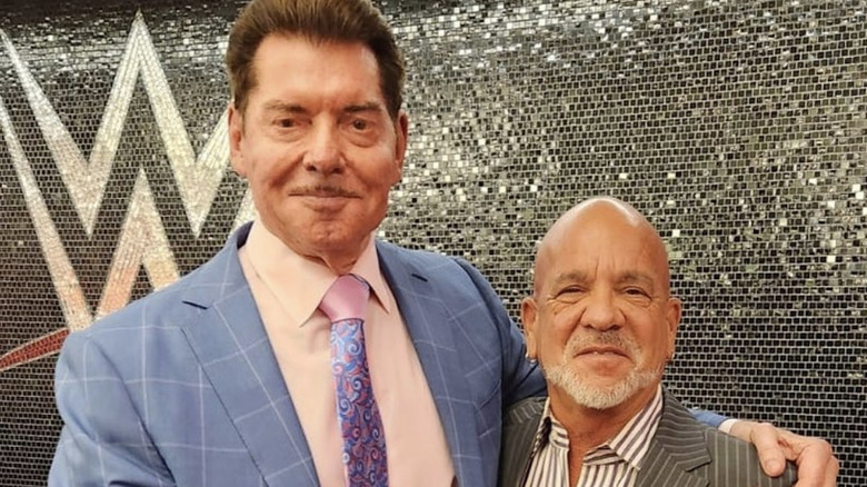 Vince McMahon and Rick Bassman smiling