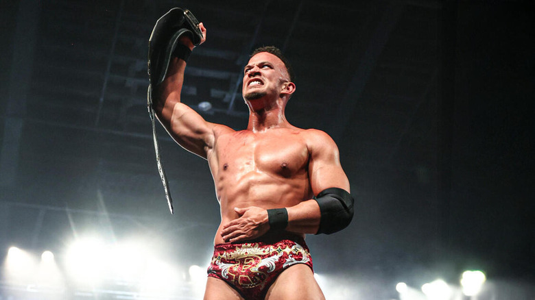 Ricky Saints grits his teeth and holds his abdomen as he raises the 