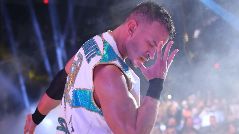 Ricky Saints hits his signature pose on the stage before heading down the ramp to the ring at Stand & Deliver 2026.