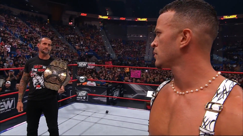 CM Punk stares at Ricky Starks 