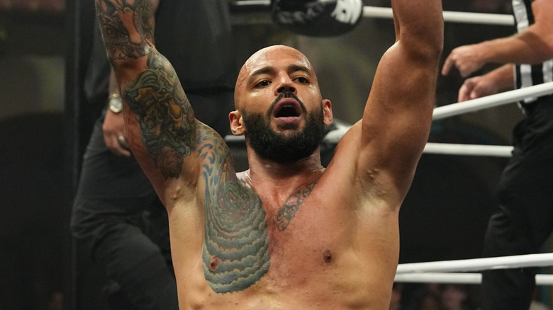 Ricochet raises his arms in victory following a match on "AEW Dynamite."