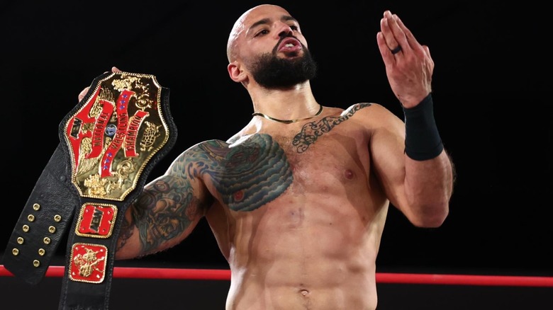 Ricochet holding the AEW National Championship