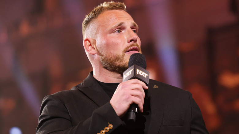 Ridge Holland speaking into a WWE NXT microphone