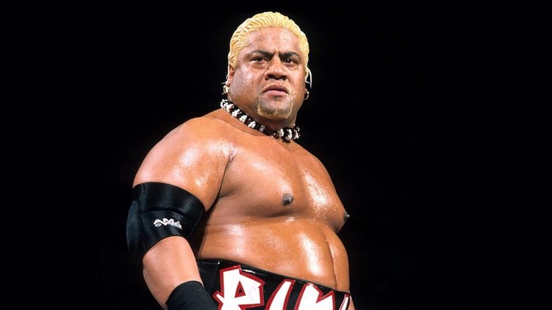 Rikishi eyeballs his opponent from inside a WWE ring.