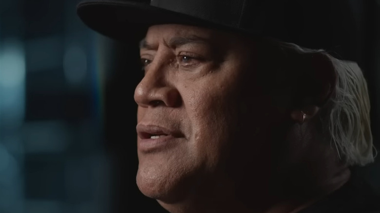 Rikishi wearing a baseball cap