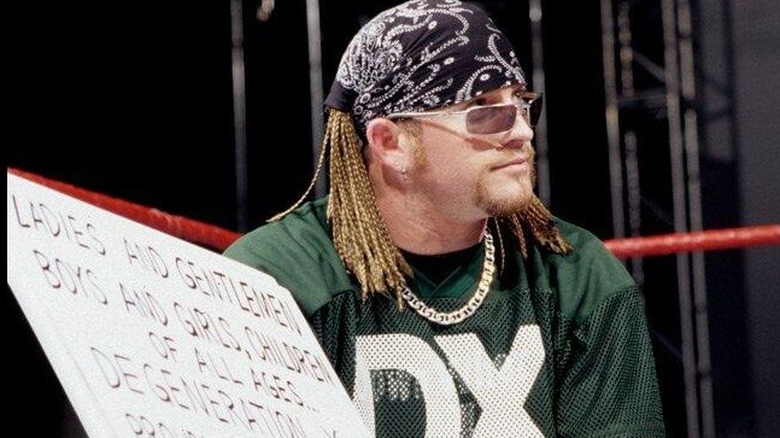 WWE Hall of Famer Road Dogg holds up cue cards for his fellow D-Generation X pals, not knowing that would be one of many roles he'd receive backstage years later