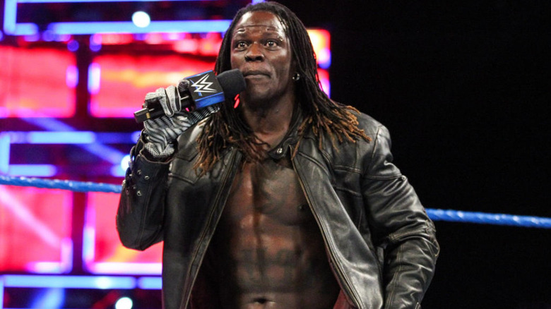 R-Truth holding a microphone