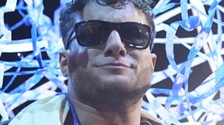 MJF wearing sunglasses with streamers