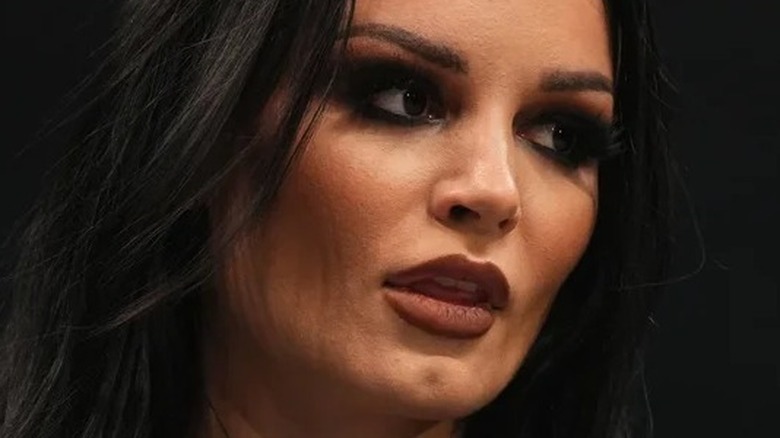 Saraya looks away