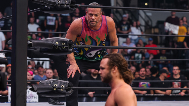 Rob Van Dam in the ring, while Jack Perry stands in foreground