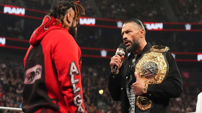 World Heavyweight Champion Roman Reigns cuts a promo on Jacob Fatu in the ring during an episode of 