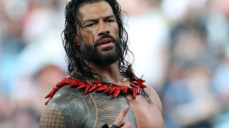 Roman Reigns points up during a match at SummerSlam.