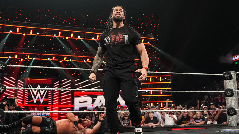 Roman Reigns standing tall in the ring