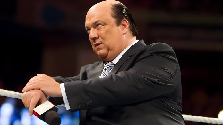 Paul Heyman holding microphone