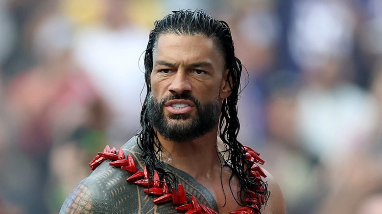 Roman Reigns learning he has to cut his vacation short