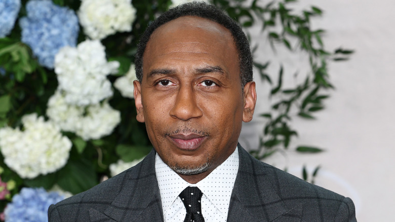 Stephen A. Smith in front of a flowery background