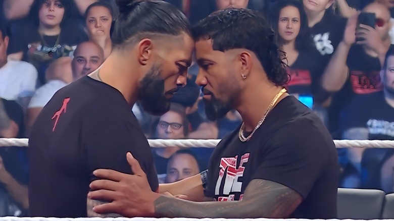 Roman Reigns forehead to forehead with Jey Uso