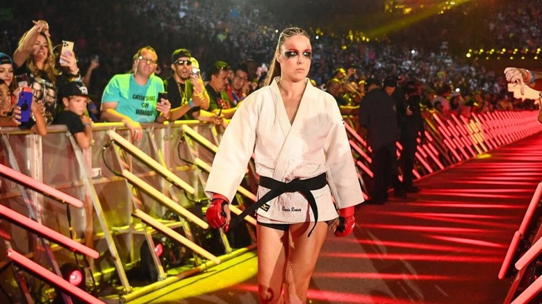 Ronda Rousey heads down the ramp to the ring, wearing her judo rope, ahead of her match against Shayna Baszler at SummerSlam 2023.