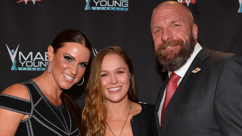 Stephanie McMahon, Ronda Rousey, and Triple H