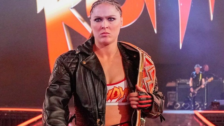 Ronda Rousey making her way to the ring with the WWE Women's RAW Championship