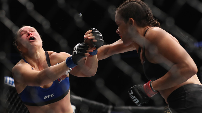 Amanda Nunes fighting Ronda Rousey